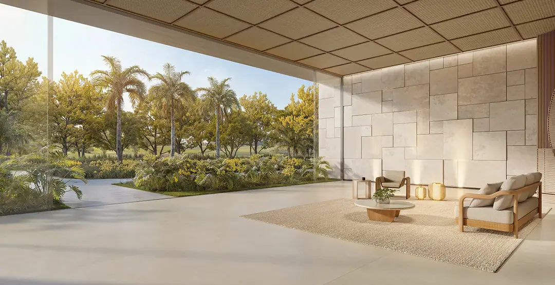 Lobby de torre do Vista Riviera, com jardim interno e pé-direito duplo